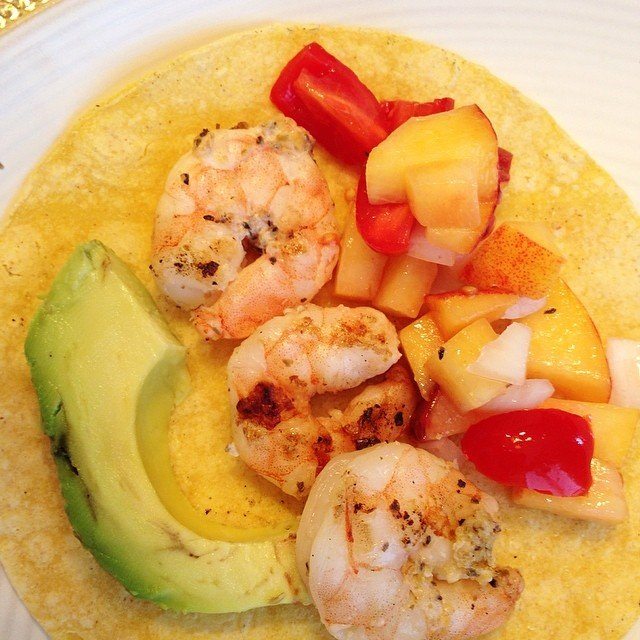 Dinner tonight... Shrimp tacos with peach salsa off the grill! Gotta grill when it's a beautiful day like today!